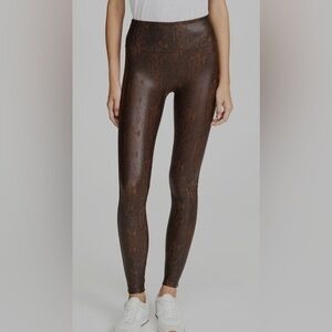 Spanks snakeskin leggings